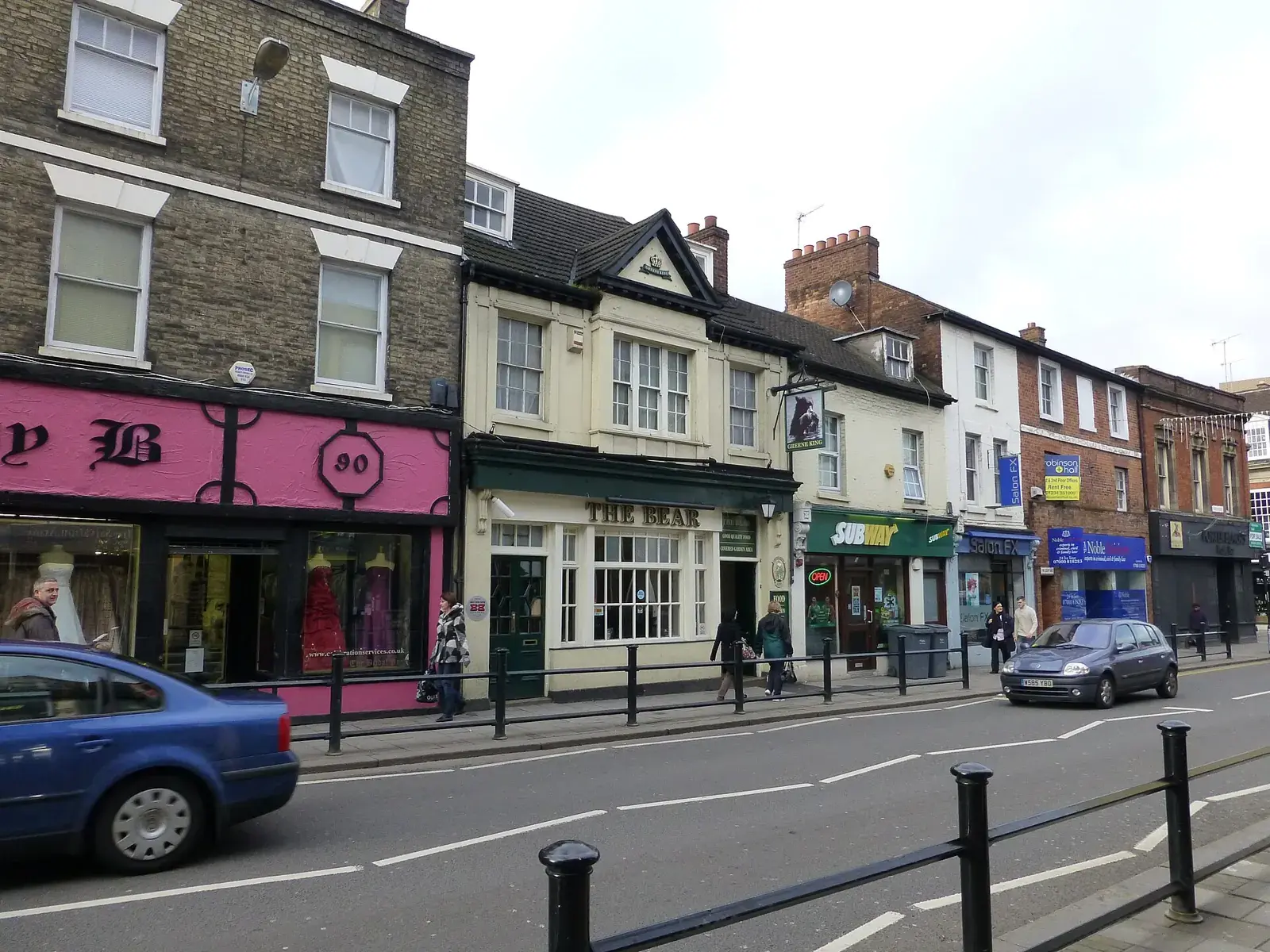 A row of shops and a pub along Bedford High Street